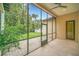 Screened porch overlooking a backyard patio and lush greenery at 1233 Aquila Loop, Celebration, FL 34747