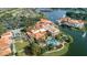 Aerial view of community with lake, clubhouse and pool at 1287 Glendora Rd, Kissimmee, FL 34759