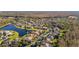 Aerial view of community with lake and many houses at 1287 Glendora Rd, Kissimmee, FL 34759