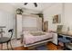 Small bedroom with a murphy bed and desk at 1287 Glendora Rd, Kissimmee, FL 34759