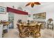 Casual dining area with wicker chairs and a glass-top table at 1287 Glendora Rd, Kissimmee, FL 34759