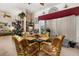 Casual dining area with wicker chairs and a glass-top table at 1287 Glendora Rd, Kissimmee, FL 34759