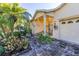 Inviting front yard with lush landscaping and brick paver driveway at 1287 Glendora Rd, Kissimmee, FL 34759