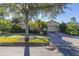 Charming curb appeal with manicured landscaping and brick driveway at 1287 Glendora Rd, Kissimmee, FL 34759