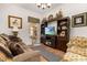 Relaxing living room with wood flooring and entertainment center at 1287 Glendora Rd, Kissimmee, FL 34759