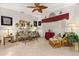 Bright living room featuring a comfy sofa and wicker chairs at 1287 Glendora Rd, Kissimmee, FL 34759