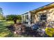 Back patio with table and chairs, great for outdoor dining at 1287 Glendora Rd, Kissimmee, FL 34759