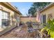 Charming brick patio with outdoor furniture, perfect for entertaining at 1287 Glendora Rd, Kissimmee, FL 34759