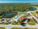 Community pool, tennis courts, and clubhouse at 1819 Coriander Dr, Kissimmee, FL 34759