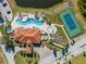 Aerial view of community pool, tennis court and clubhouse at 1819 Coriander Dr, Kissimmee, FL 34759