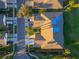 Aerial view of house with blue tarp on roof at 197 Club Villas Ln, Kissimmee, FL 34744