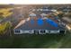 Aerial view of house with partial roof tarp at 197 Club Villas Ln, Kissimmee, FL 34744