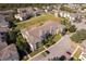 Apartment building with parking and green space, seen from above at 2302 Butterfly Palm Way # 303, Kissimmee, FL 34747