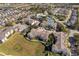 Community overview showing apartment buildings, pools, and tennis courts at 2302 Butterfly Palm Way # 303, Kissimmee, FL 34747