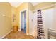 Bathroom with shower, tile flooring, and access to another room at 2302 Butterfly Palm Way # 303, Kissimmee, FL 34747
