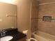 Clean bathroom with a shower/tub combo and dark vanity at 2303 Walnut Canyon Dr, Kissimmee, FL 34758
