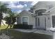 House exterior featuring a well-maintained lawn and a neutral color palette at 2303 Walnut Canyon Dr, Kissimmee, FL 34758
