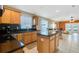 Modern kitchen with an island, stainless steel appliances, and granite countertops at 2303 Walnut Canyon Dr, Kissimmee, FL 34758