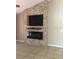 Stone fireplace and built-in entertainment center are focal points in this living room at 2303 Walnut Canyon Dr, Kissimmee, FL 34758