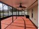 Large screened patio with ceiling fan and lake view at 2303 Walnut Canyon Dr, Kissimmee, FL 34758