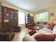 Relaxing library with a painted bookshelf mural and two sofas at 2603 Isla Bonita Ct, Kissimmee, FL 34747