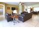 Living area with leather sofas, a media console, and a view to dining area at 2603 Isla Bonita Ct, Kissimmee, FL 34747