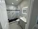 Elegant bathroom with marble shower and modern vanity at 2614 Pineway Dr, Orlando, FL 32839