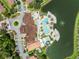 Community pool and clubhouse with surrounding residences at 2618 Bugatti Ct, Kissimmee, FL 34746