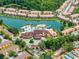 Aerial view of community pool, clubhouse, and lake at 2618 Bugatti Ct, Kissimmee, FL 34746