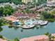 Aerial view of community pool and clubhouse with lake at 2618 Bugatti Ct, Kissimmee, FL 34746
