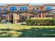 Screened patio and grassy backyard with lush hedges at 2618 Bugatti Ct, Kissimmee, FL 34746