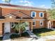 Attractive townhome with tiled roof and landscaping at 2618 Bugatti Ct, Kissimmee, FL 34746
