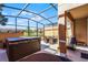 Enjoy the screened patio with hot tub and outdoor dining at 2618 Bugatti Ct, Kissimmee, FL 34746