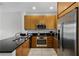 Modern kitchen with stainless steel appliances and granite countertops at 2618 Bugatti Ct, Kissimmee, FL 34746