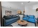 Open living room features a comfortable sofa and view of the kitchen at 2618 Bugatti Ct, Kissimmee, FL 34746