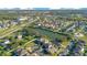 Aerial view showing neighborhood homes and a central lake at 2811 Sonata Ct, St Cloud, FL 34772