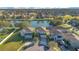 Aerial view of house and neighborhood with lake at 2811 Sonata Ct, St Cloud, FL 34772