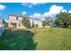 Expansive backyard with two houses and green lawn at 2811 Sonata Ct, St Cloud, FL 34772