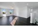 Bright bonus room with dark laminate floors and two windows at 2811 Sonata Ct, St Cloud, FL 34772