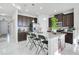 Modern kitchen with dark brown cabinets, granite island, and stainless steel appliances at 2811 Sonata Ct, St Cloud, FL 34772