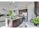 Kitchen with island, stainless steel appliances, and granite countertops at 2811 Sonata Ct, St Cloud, FL 34772