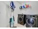 Laundry room with washer, dryer, and storage shelving at 2811 Sonata Ct, St Cloud, FL 34772