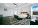 Main bedroom with king bed, dark wood floors, and large windows at 2811 Sonata Ct, St Cloud, FL 34772