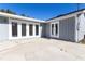 Home exterior featuring gray siding and French doors leading to the backyard at 3426 Somerset Ave, Deltona, FL 32738