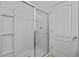 Clean bathroom with a shower and glass enclosure at 355 Highcrest Rd, Davenport, FL 33896