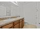 Double vanity bathroom with wood cabinets and a toilet at 355 Highcrest Rd, Davenport, FL 33896