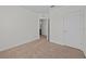 Simple bedroom with carpet flooring and an attached bathroom at 355 Highcrest Rd, Davenport, FL 33896