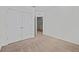 Spacious bedroom with carpeted floor and double doors to a closet at 355 Highcrest Rd, Davenport, FL 33896