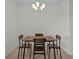 Dining area with wood table and four chairs at 355 Highcrest Rd, Davenport, FL 33896