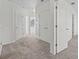 Bright hallway with carpeted floor and white doors at 355 Highcrest Rd, Davenport, FL 33896